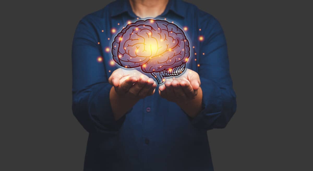 Brain on the palm. Mental health protection and care. Artificial Intelligence, AI Technology. Business analysis, innovation, technology in science and medicine